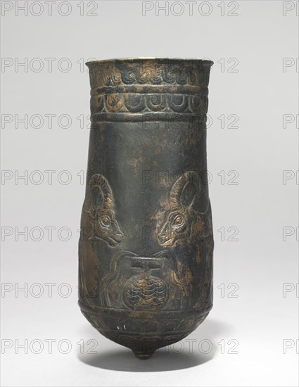 Button-Based Situla, 900-700 BC. Iran, Luristan, 9th-7th Century BC. Bronze, repoussé, punched, incised; diameter: 6.2 cm (2 7/16 in.); overall: 13.1 cm (5 3/16 in.).