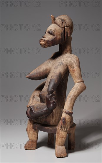 Mother-and-Child Figure, 1800s-1900s. Africa, Guinea Coast, Ivory Coast, Senufo people, 19th-20th century. Wood; overall: 63.6 cm (25 1/16 in.)