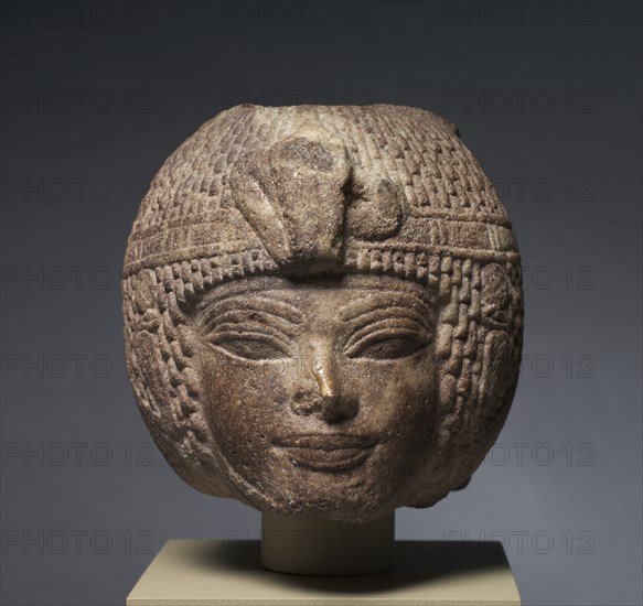 Head of Amenhotep III Wearing the Round Wig, c. 1391-1353 BC. Egypt, New Kingdom, Dynasty 18, reign of Amenhotep III, 1391-1353 BC. Brown quartzite; overall: 17.3 x 17 x 25.3 cm (6 13/16 x 6 11/16 x 9 15/16 in.).