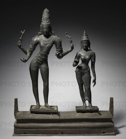 Shiva and Parvati, c. 950-960. South India, Tamil Nadu, Chola period (900-13th Century). Bronze; base: 21.6 x 79.5 x 24.9 cm (8 1/2 x 31 5/16 x 9 13/16 in.); part 1: 81.9 x 48.7 cm (32 1/4 x 19 3/16 in.); part 2: 65.1 x 16.5 cm (25 5/8 x 6 1/2 in.).