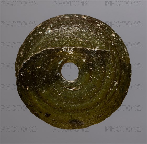 Spindle Whorl, 700s - 900s. Iran, early Islamic period, 8th - 10th century. Glass; overall: 0.7 x 2.6 x 2.6 cm (1/4 x 1 x 1 in.)