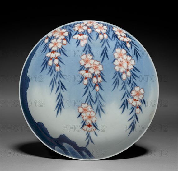 Dish with Weeping Cherry Tree, late 1800s. Japan, Meiji period (1868-1912). Porcelain with underglaze blue and overglaze red enamel (Hizen ware, Nabeshima type); diameter: 15 cm (5 7/8 in.).