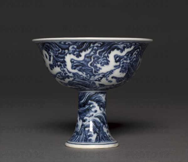 Stem Cup, 1426-1435. China, Jiangxi province, Jingdezhen, Ming dynasty (1368-1644), Xuande mark and period (1426-1435). Porcelain with reversed underglaze blue and incised decoration; diameter: 10.1 cm (4 in.); overall: 9 cm (3 9/16 in.).
