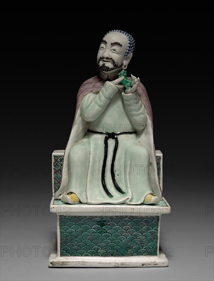 Lohan Holding a Fu Dog, 1662-1722. China, Jiangxi province, Jingdezhen kilns, Qing dynasty (1644-1912), Kangxi reign (1661-1722). Porcelain with famille verte overglaze enamel decoration; overall: 24.3 x 12.6 cm (9 9/16 x 4 15/16 in.).