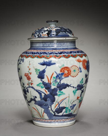 Covered Jar with Chrysanthemums, Peonies, and Prunus: In Kakiemon Style, late 17th century. Japan, Edo Period (1615-1868). Porcelain with underglaze blue and overglaze enamel decoration; diameter: 17.8 cm (7 in.); overall: 25.1 cm (9 7/8 in.).