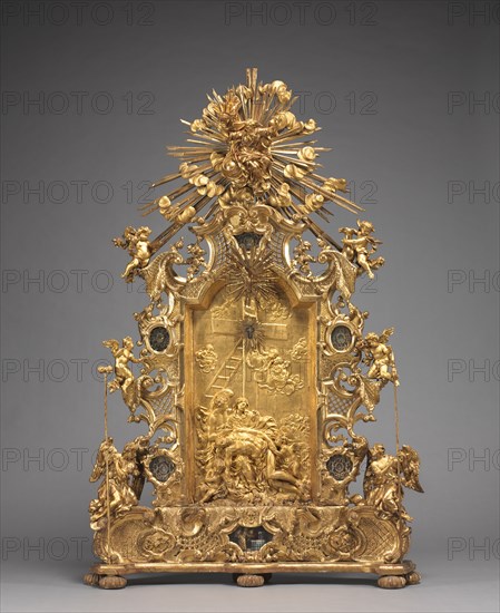Altarpiece with Relics, c. 1735-1740. And workshop Joseph Matthias Götz (German, 1696-1760). Gilded wood, with relics in niches: gilded wood, mother-of-pearl, ebony, red silk, gold wire, seed pearls, rock crystal, pen and ink on paper; overall: 165.1 x 108 x 20 cm (65 x 42 1/2 x 7 7/8 in.).