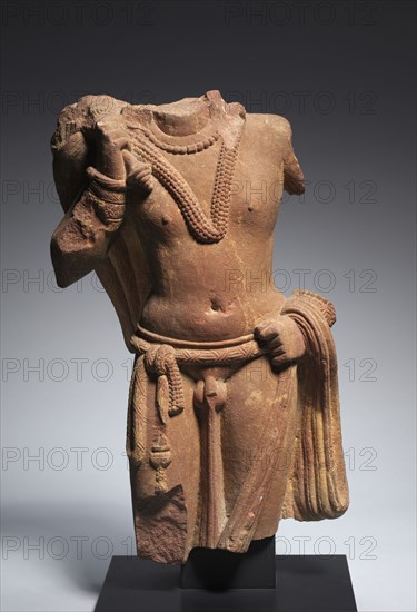 Attendant Bearing a Fly Whisk (Chauri), c. 100-150. Northern India, Uttar Pradesh, Mathura, Kushan period (c. 80-320). Red sandstone; overall: 55.8 cm (21 15/16 in.).