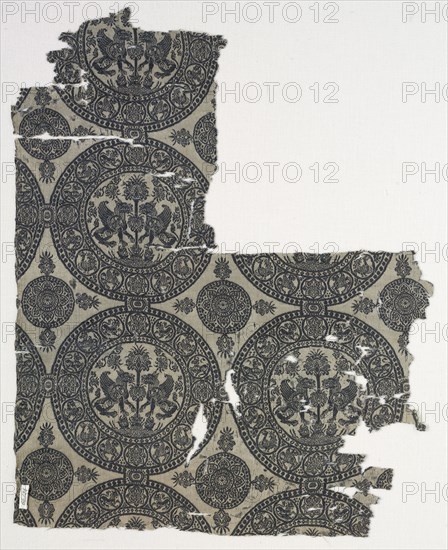 Fragments with Griffins in Roundels, 1100s. Iran or Iraq, Seljuk period, 12th century. Lampas weave, silk; overall: 41 x 32.8 cm (16 1/8 x 12 15/16 in.)