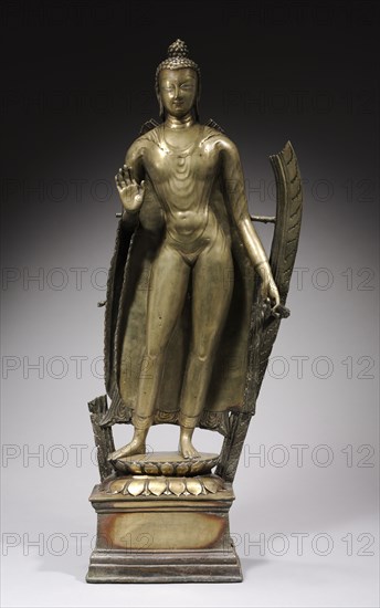 Standing Buddha, c. 900. India, Kashmir, late 10th-early 11th century. Brass with silver and copper inlay; overall: 98.1 cm (38 5/8 in.); base: 28.2 cm (11 1/8 in.).
