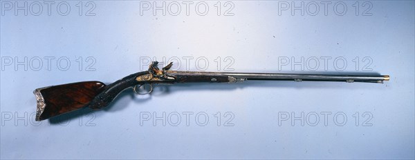 Double-Barrelled Flintlock Sporting Gun of Napoleon  I Bonaparte, 1809. Jean Le Page (French). Blued steel with gilt decoration; walnut stock; chiseled mounts; overall: 116.8 cm (46 in.); butt: 10.8 cm (4 1/4 in.); barrel: 76.3 cm (30 1/16 in.); bore: 1.6 cm (5/8 in.).