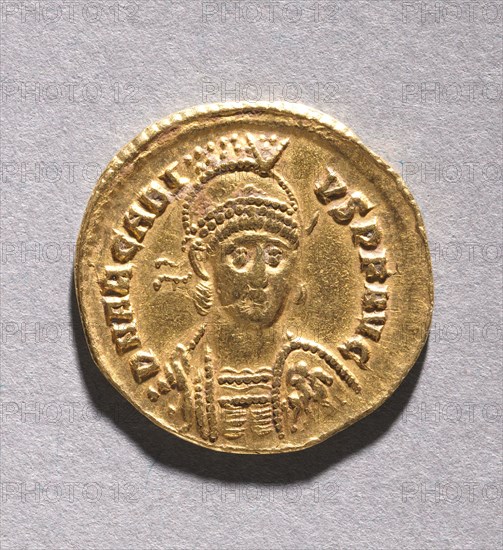 Tremissis of Honorius , 395-423. Byzantium, Ravenna, Byzantine period, late 4th-early 5th Century. Gold; diameter: 1.5 cm (9/16 in.).