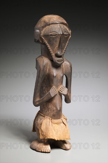 Male Figure, late 1800s-early 1900s. Central Africa, Democratic Republic of the Congo, Pre-Bembe, late 19th-early 20th century. Wood, cloth; overall: 48.6 x 15.6 x 17.2 cm (19 1/8 x 6 1/8 x 6 3/4 in.)