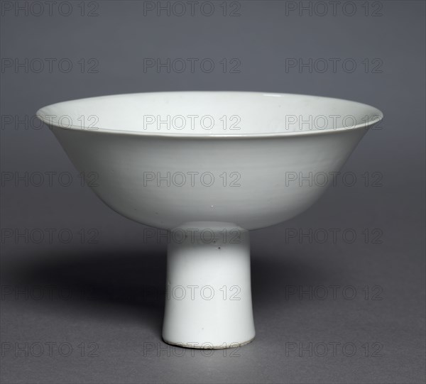 Stem Cup with Buddhist Emblems: Shufu Ware, 1300s. China, Jiangxi province, Yuan dynasty (1271-1368). Porcelain with molded decoration and white glaze; overall: 10.2 x 15.3 cm (4 x 6 in.).