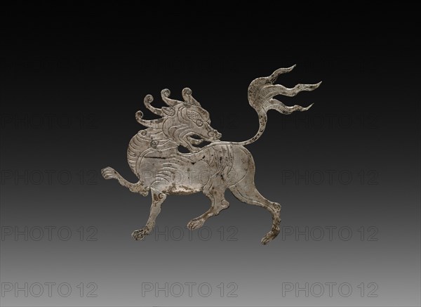 Inlay for a Mirror or Box: shih-shih, c. 900-1000. China, Tang dynasty (618-907) - Song dynasty (960-1279). Beaten silver with chased details; overall: 4.6 x 5.2 cm (1 13/16 x 2 1/16 in.).