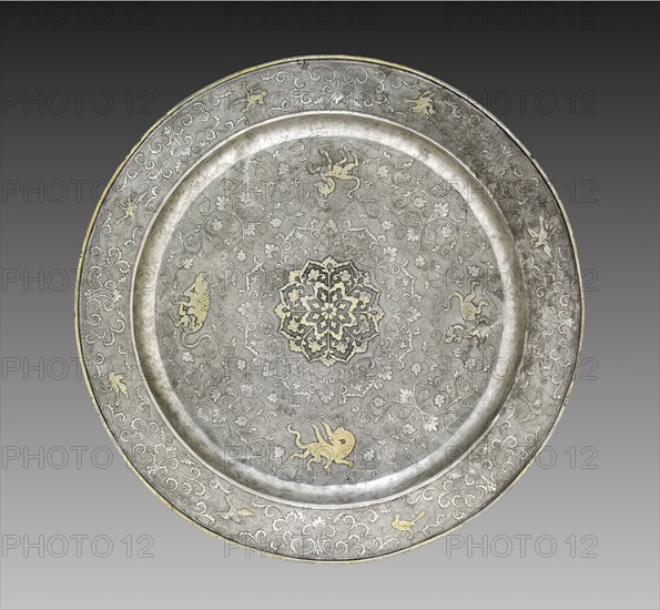 Footed Platter with Design of Mythical Beasts amid Grapevines, 700s. China, Tang dynasty (618-907). Silver with gilt, incised, and chased decoration; diameter: 30.5 cm (12 in.).