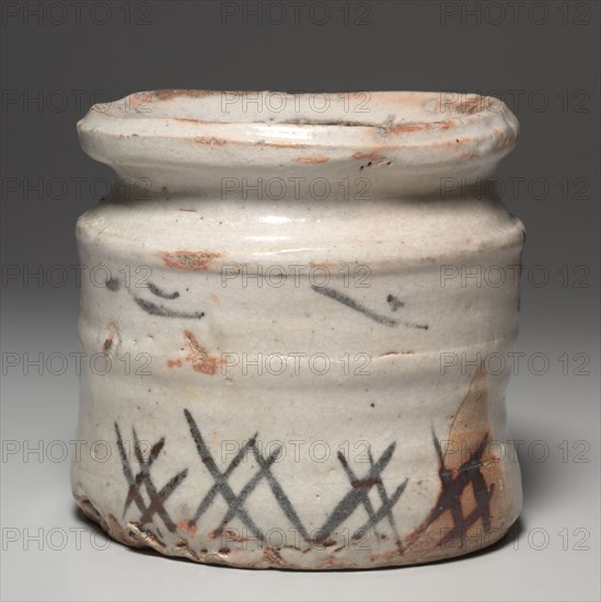 Water Container (Mizusashi) with Grasses, late 1500s–early 1600s. Japan, Momoyama period (1573-1615) to Edo period (1615-1858). Stoneware with underglaze iron oxide slip decoration (Mino ware, Shino type); diameter: 19.6 cm (7 11/16 in.); lid: 2.9 x 14.7 cm (1 1/8 x 5 13/16 in.); container: 18.4 cm (7 1/4 in.).
