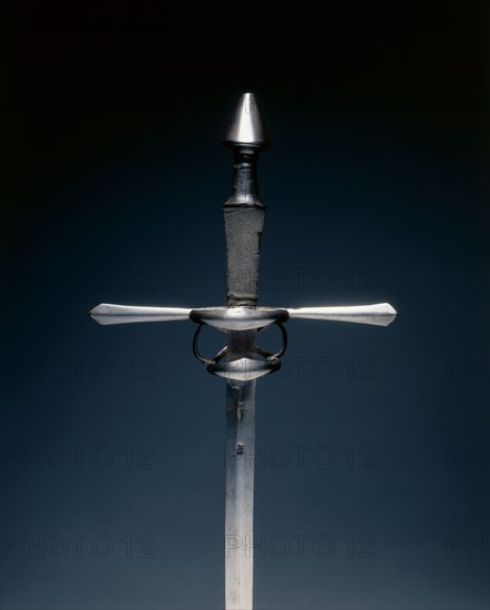 Hand-and-a-Half Sword, c.1540-1580. Germany, 16th century. Steel; wood, leather, sharkskin grip; overall: 116.8 cm (46 in.); blade: 94.8 cm (37 5/16 in.); quillions: 31 cm (12 3/16 in.); grip: 21 cm (8 1/4 in.).