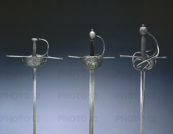 Rapier, c. 1580-1610. Blade: Spain, Toledo   Hilt: Italt, Belluno?, late 16th-early 17th Century. Steel, ribbed guard and pommel; wood and wire; overall: 135.9 cm (53 1/2 in.); blade: 111.1 cm (43 3/4 in.); quillions: 25.5 cm (10 1/16 in.); grip: 16.5 cm (6 1/2 in.).
