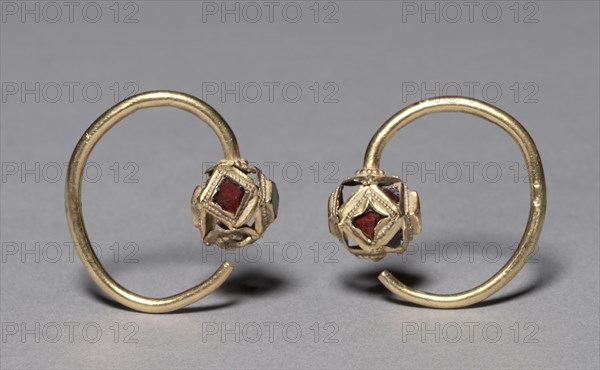 Earring, 400s. Ostrogothic, Migration period, 5th century. Gold with garnets; overall: 3.5 x 3.6 x 1.1 cm (1 3/8 x 1 7/16 x 7/16 in.).