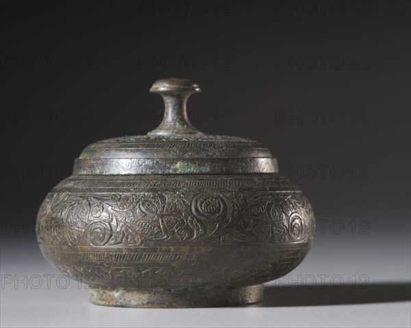 Reliquary Box, 200-400. Pakistan, Gandhara, probably Swat, late Kushan period (AD 1-320). Bronze; diameter: 8.6 cm (3 3/8 in.); overall: 7 cm (2 3/4 in.).
