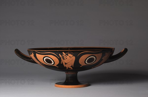 Eye Cup, c. 520 BC. Attributed to Psiax (Greek). Red-figure terracotta; diameter: 6.4 cm (2 1/2 in.); overall: 11.2 x 33.6 cm (4 7/16 x 13 1/4 in.); diameter of rim: 26 cm (10 1/4 in.); diameter of foot: 10.2 cm (4 in.).