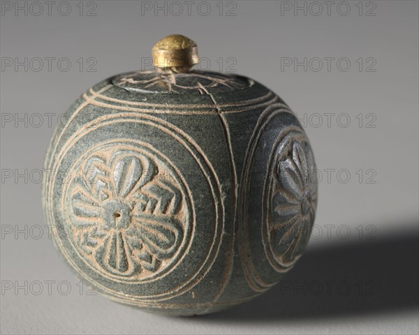 Miniature Stone Reliquary or Toilette Casket, 1-100. Pakistan, Gandhara, probably Sirkap, early Kushan Period (AD 1-320). Gray schist; diameter: 4 cm (1 9/16 in.); overall: 4.2 cm (1 5/8 in.).