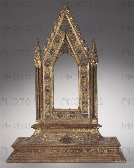 Frame for a Portable Reliquary Icon, 1347. Italy, Siena, 14th century. Gilded wood, modeled gesso, verre églomisé, glass cabochons, and relics; overall: 66.7 x 51.3 x 25.3 cm (26 1/4 x 20 3/16 x 9 15/16 in.).