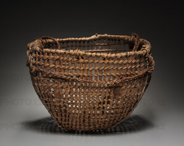 Clam basket with Tump Line, late 1800. Northwest Coast, Clallam, late 19th century. Cedar root; openwork, braided, plaited; overall: 32.5 x 42.5 cm (12 13/16 x 16 3/4 in.); cord: 101.6 cm (40 in.).