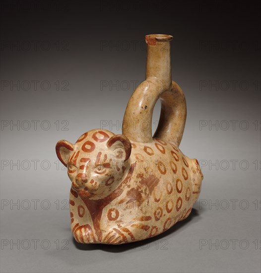 Stirrup Spouted Vessel of Feline Form, 1st millenium. Peru, Mochica. Red earthenware decorated with cream-colored slip and brown pigment; overall: 19.3 x 9.7 x 21 cm (7 5/8 x 3 13/16 x 8 1/4 in.).