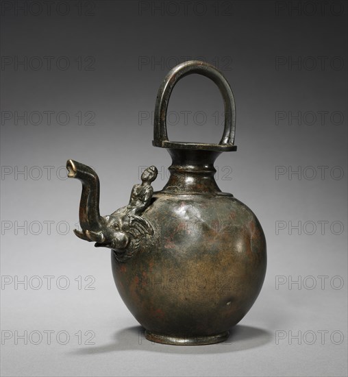 Ewer with Spout in the Form of an Elephant with a Mahut, c. 1st Century. Afghanistan, Gandhara, probably Taxila or environs, Early Kushan Period (1st century-320). Bronze; overall: 21 cm (8 1/4 in.); diameter of base: 6.4 cm (2 1/2 in.).