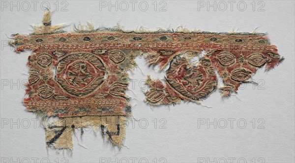Fragment of a Band, 600s - 800s. Egypt, Umayyad or Abbasid period, 7th - 9th century. Tabby ground, inwoven tapestry ornament; wool; overall: 20 x 35.5 cm (7 7/8 x 14 in.)
