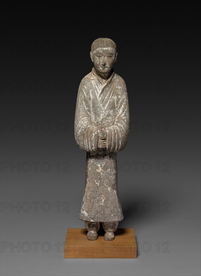 Female Attendant (Tomb Figurine), c. 2nd Century BC. China, probably Shensi province, Western Han dynasty (202 BC-AD 9). Gray earthenware with slip coating and traces of polychromy; overall: 54.9 cm (21 5/8 in.).