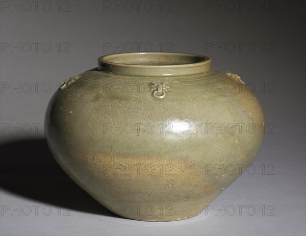 Jar:  Proto-Yue ware, 265-317. China, Western Jin dynasty (265-316). Gray stoneware with combed, impressed, molded and applied decoration under iron glaze; diameter: 23.8 cm (9 3/8 in.); overall: 17.2 cm (6 3/4 in.); diameter of mouth with rim: 12.2 cm (4 13/16 in.).