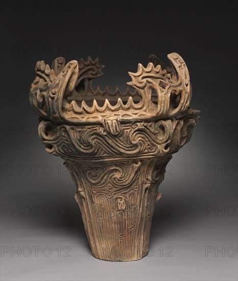 Flame-Style Storage Vessel, c. 2500 BC. Japan, Middle Jomon Period (c. 10,500-c. 300 BC). Earthenware with carved and applied decoration; diameter: 55.8 cm (21 15/16 in.); overall: 61 cm (24 in.).