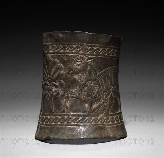 Decorated Cylinder, c. 1000-800 BC. Iran, Mannaean, Ziwiye, 10th-9th century BC. Bronze, repoussé and incised; overall: 7.1 x 6.4 x 5.7 cm (2 13/16 x 2 1/2 x 2 1/4 in.).