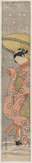 Young Woman Standing Under an Umbrella in the Snow, 1767-1768. Suzuki Harunobu (Japanese, 1724-1770). Color woodblock print; pillar print; sheet: 71.1 x 12.7 cm (28 x 5 in.).