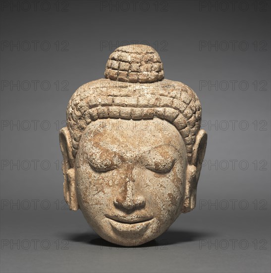 Head of Buddha, c. 7th Century. Thailand, Mon-Dvaravati period. Stucco; overall: 15.7 x 11.7 cm (6 3/16 x 4 5/8 in.).