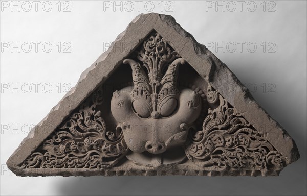 Pediment with the face of Glory (Kirti-mukha), c. 1000s. North India, 11th century. Sandstone; overall: 50.8 x 94 cm (20 x 37 in.).
