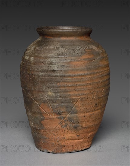 Storage Jar: Bizen Ware, late 1400s-early 1500s. Japan, Muromachi Period (1392-1573). Stoneware with natural ash glaze, incised comb pattern, and incised potter's mark; diameter: 18.8 cm (7 3/8 in.); overall: 25.5 cm (10 1/16 in.).
