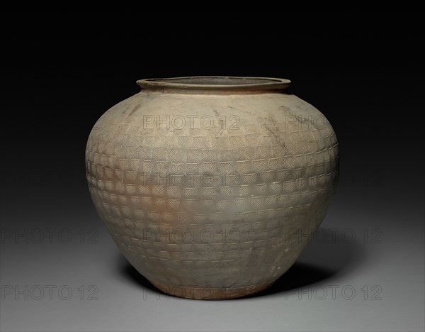 Jar, 25-220. China, Zhejiang province, Eastern Han dynasty (25-220). Stoneware with impressed decoration; diameter of mouth: 23.2 cm (9 1/8 in.); overall: 36 cm (14 3/16 in.).