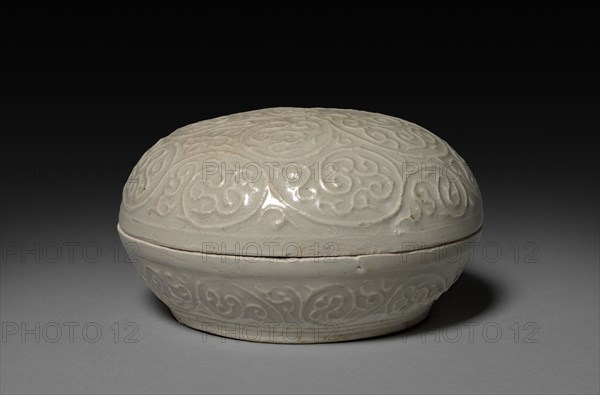 Round Covered Box with Floral Scrolls in Relief:  Qingbai type Ware, 14th Century. China, Fujian province, Anxi xian, Yuan dynasty (1271-1368). Glazed porcelain with slip decoration; overall: 8.6 x 15.5 cm (3 3/8 x 6 1/8 in.).