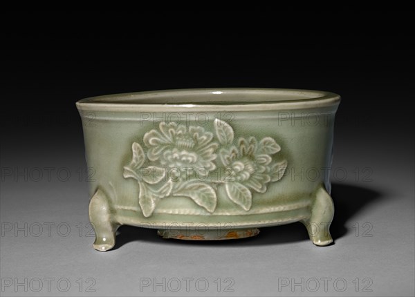 Incense Burner in Form of Archaic Lian with Peonies in Refief:  Longquan Ware, 14th Century. China, Zhejiang province, Yuan dynasty (1271-1368). Glazed porcelain with molded decoration; diameter: 12.6 cm (4 15/16 in.); overall: 7.1 cm (2 13/16 in.).