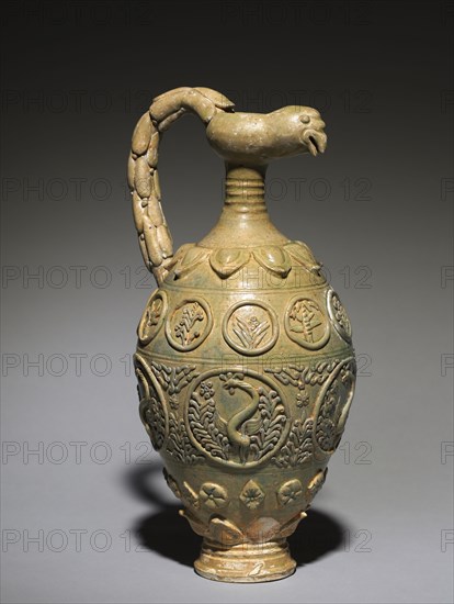 Bird-Headed Ewer, 600s-700s. China, probably Henan province, Tang dynasty (618-907). Green-glazed stoneware with modeled, molded, and applied decoration; overall: 42.1 cm (16 9/16 in.).