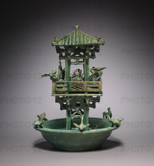Watchtower, 25-220. China, Eastern Han dynasty (25-220). Earthenware with lead glaze; diameter: 39 cm (15 3/8 in.); overall: 54.3 cm (21 3/8 in.).