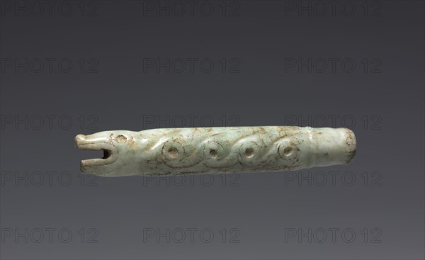 Serpent-form Fan Handle(?), 900-1519. Central Mexico, Mixtec. Pale green jade; diameter: 1.9 cm (3/4 in.); overall: 10.5 x 2 cm (4 1/8 x 13/16 in.).