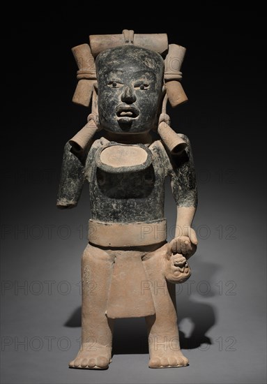 Standing Male Figure, 300-900. Mexico, Gulf Coast, 4th-10th Century. Earthenware, asphalt and resin paint; overall: 58.5 x 24.8 x 14.7 cm (23 1/16 x 9 3/4 x 5 13/16 in.).