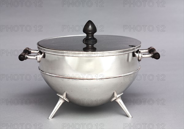 Tureen, c. 1880. Hukin & Heath (British), Christopher Dresser (British, 1834-1904). Silver plated metal, ebony handles and knop; diameter: 23.5 cm (9 1/4 in.); overall: 21.2 x 30.8 cm (8 3/8 x 12 1/8 in.).