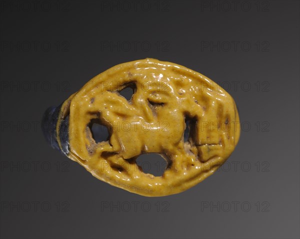 Ring: Gazelle Eating Thicket, 1391-1353 BC. Egypt, New Kingdom, Dynasty 18, reign of Amenhotep III to Akhenaten. Polychrome faience (yellow and purple); diameter: 2.5 cm (1 in.).