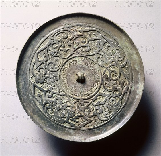 Mirror with Serpentine Interlaces and Angular Meanders, early 5th-late 3rd century BC. China, Eastern Zhou dynasty (771-256 BC), Warring States period (475-221 BC). Bronze; diameter: 11.7 cm (4 5/8 in.); overall: 0.6 cm (1/4 in.); rim: 0.5 cm (3/16 in.).