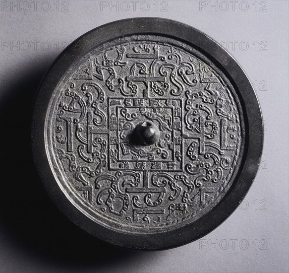 TLV Mirror with Serpentine Interlaces, late 2nd-1st century BC. China, Western Han dynasty (202 BC-AD 9). Bronze; diameter: 14 cm (5 1/2 in.); overall: 1 cm (3/8 in.); rim: 0.5 cm (3/16 in.).